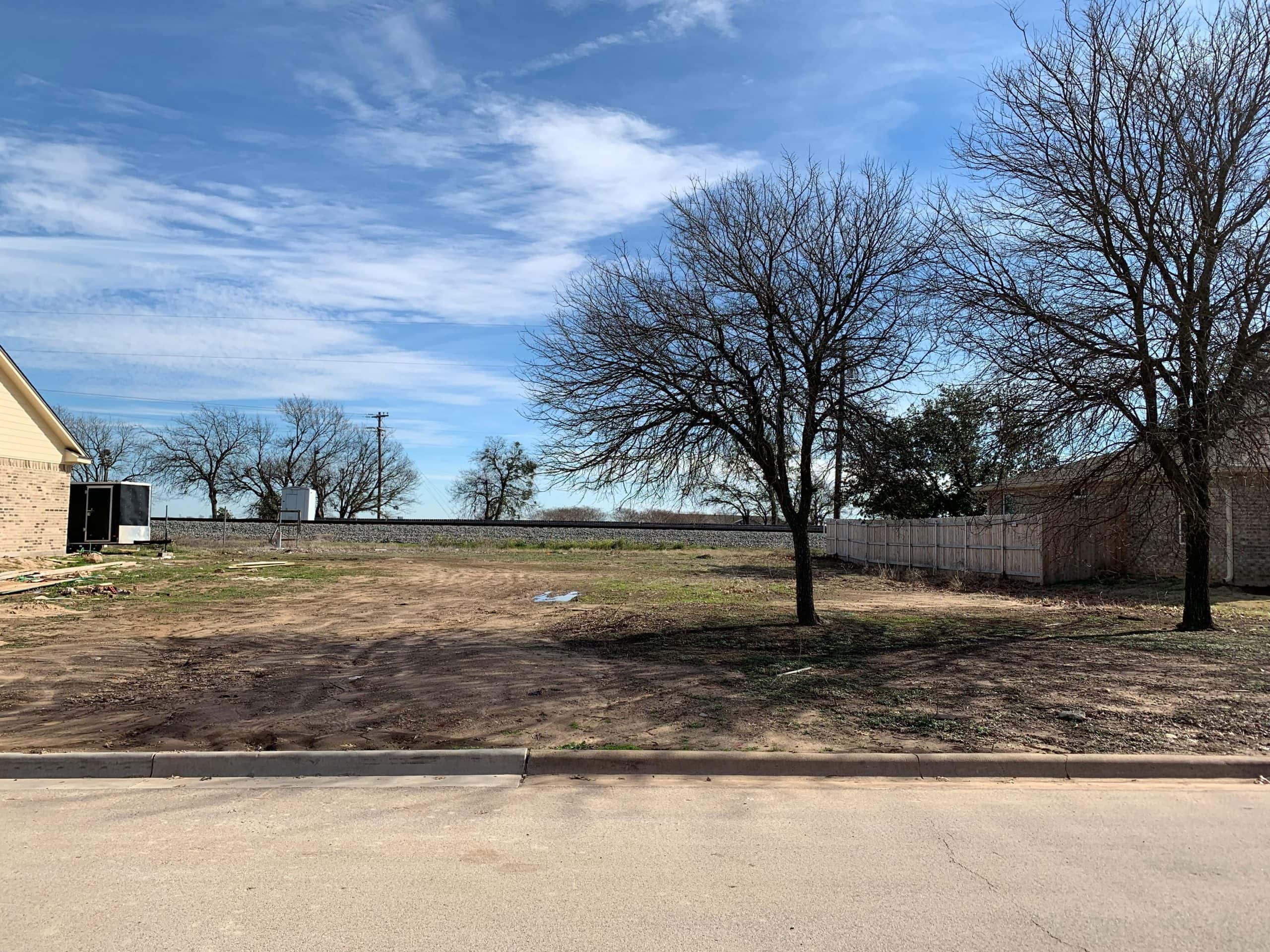 Empty lot with trees and clear sky in Hillsboro, West, Hill County.