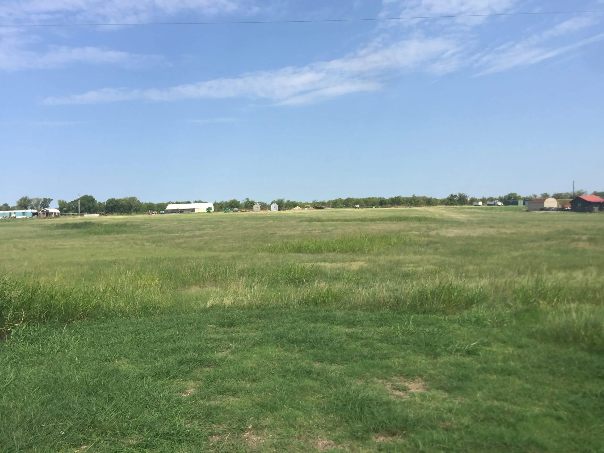 Open field in Hillsboro, West, Texas, ideal for real estate development or farming.